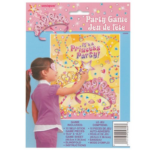Girl in a pink top shows off a princess-themed party game package with a bright yellow central artwork and sparkling decorations on a blue background.