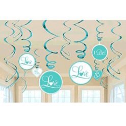 Teal circular wedding ornaments reading 'Love' and 'I Do!' hanging from curled ribbons in a sunlit room.