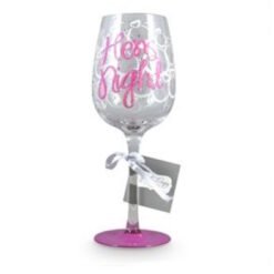 Decorated stemmed glass with pink script text and a small gift tag tied to the stem.
