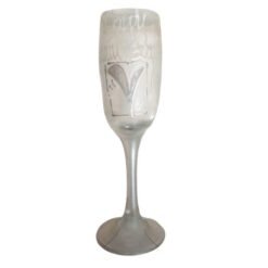 Champagne flute with etched design on the bowl and a frosted stem, standing on a white background