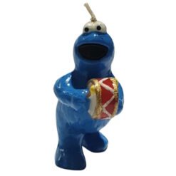 Blue clay creature with open mouth and white eyes holding a small red-and-gold drum.