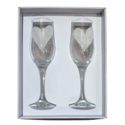 Two champagne flutes with glittery white hearts inside, presented in a white gift box for a Valentine/romantic gift.