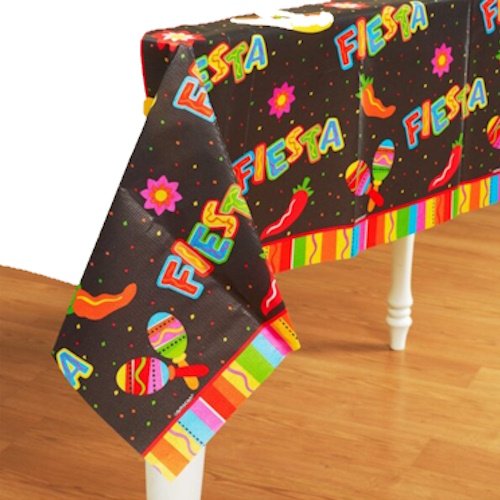Table covered with a black Fiesta-themed cloth featuring colorful 'FIESTA' text, peppers, maracas, flowers, and a bright striped border.