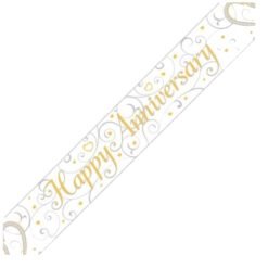 White celebration sash with gold script reading 'Happy Anniversary' and decorative swirls.