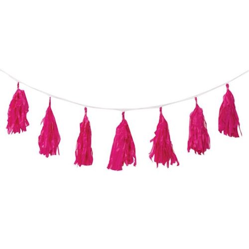 Pink tassel garland hanging on a string, used as party decor.