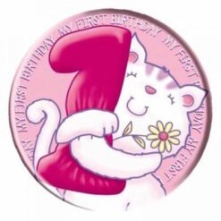 Round pink birthday badge featuring a white cat hugging a large red number 1, with a yellow flower; edge text reads 'My first birthday'