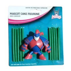 Plastic mascot cake figurine in red and blue, flanked by two green candles on blue packaging.