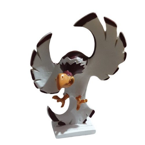 Decorative eagle figurine with wings spread wide, perched on a white pedestal.