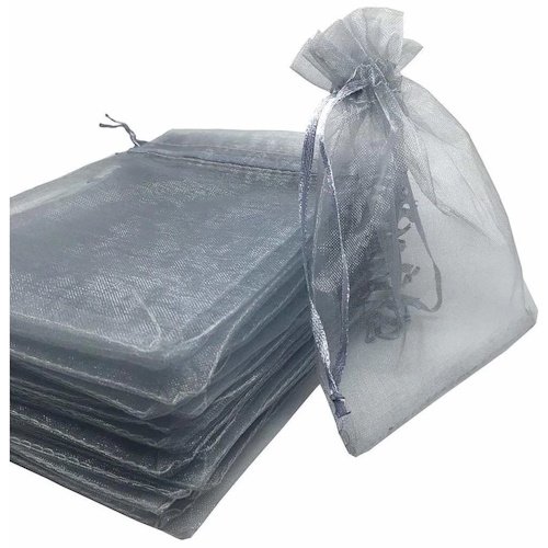 Stack of black organza gift bags with drawstrings, some opened at the top edge.