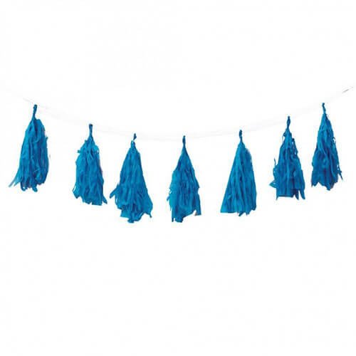 Blue tassel garland hanging on a string against a white background.