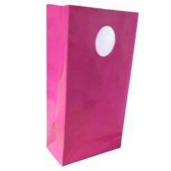 Pink glossy gift bag with a white circular tag, standing upright against a white background