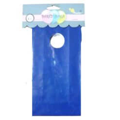 Blue gift bag with a circular hole near the top serving as a handle, against a white background with pastel packaging at the top edge of the bag.