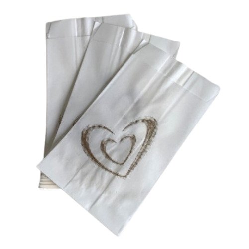 Set of white cloth napkins with a stitched heart design.