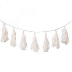 White tassel garland hanging on a string, decorative bunting for celebrations