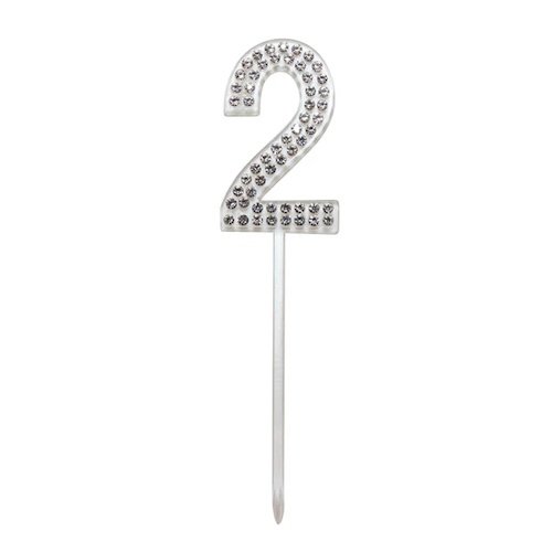 Rhinestone-encrusted number 2 cake topper on a white stick