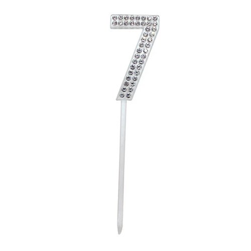 Silver rhinestone-covered number 7 cake topper on a white stick