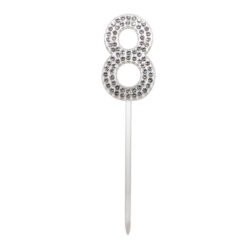 Silver rhinestone-encrusted number 8 cake topper on a stick used as a celebration decoration