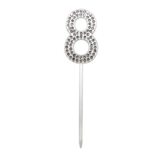 Silver rhinestone-encrusted number 8 cake topper on a stick used as a celebration decoration