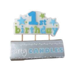 Cake candle reading '1st birthday' in blue and green, placed on a silver package labeled 'Party Candles'.